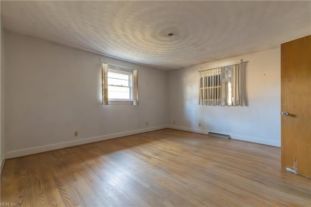 empty room with light wood-type flooring