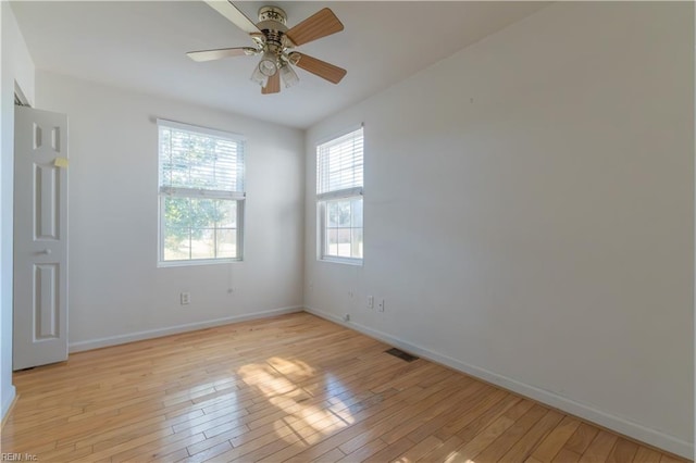 unfurnished room with ceiling fan and light wood-type flooring