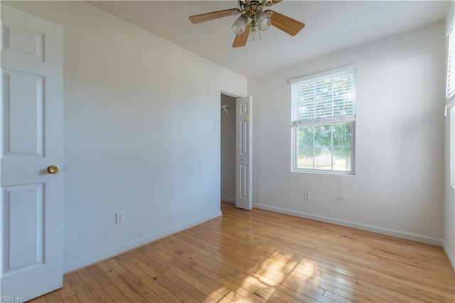 empty room featuring ceiling fan and light wood-type flooring