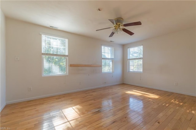 spare room featuring ceiling fan and light wood-type flooring