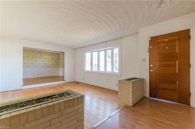 foyer entrance featuring hardwood / wood-style floors