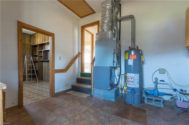 utility room featuring gas water heater