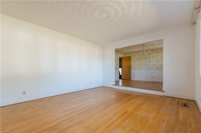 empty room featuring hardwood / wood-style flooring