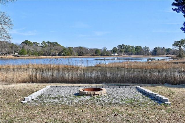 water view with a fire pit