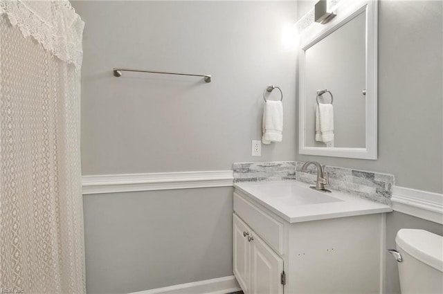 bathroom with vanity and toilet