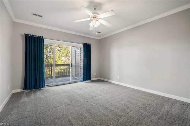 carpeted spare room with ceiling fan and ornamental molding