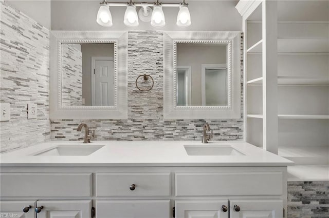 bathroom featuring vanity and decorative backsplash