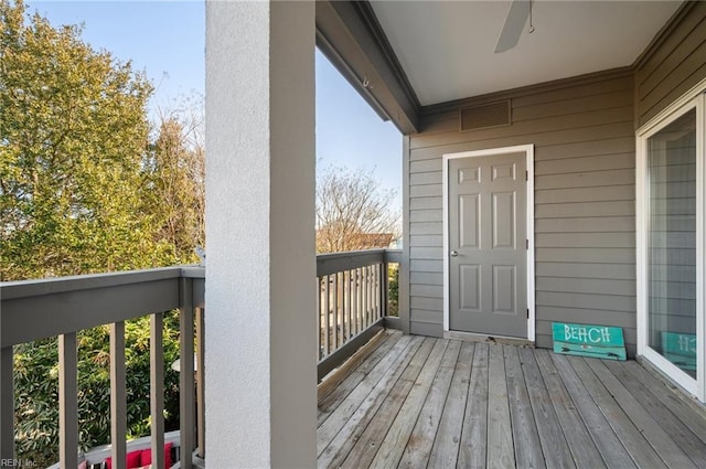 wooden terrace with ceiling fan