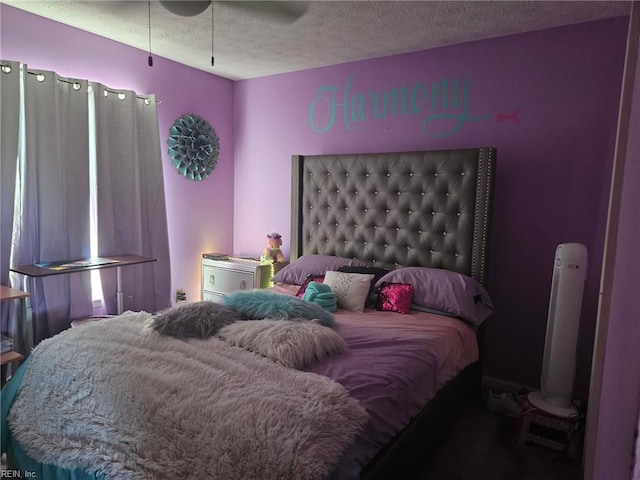 bedroom featuring a textured ceiling and ceiling fan