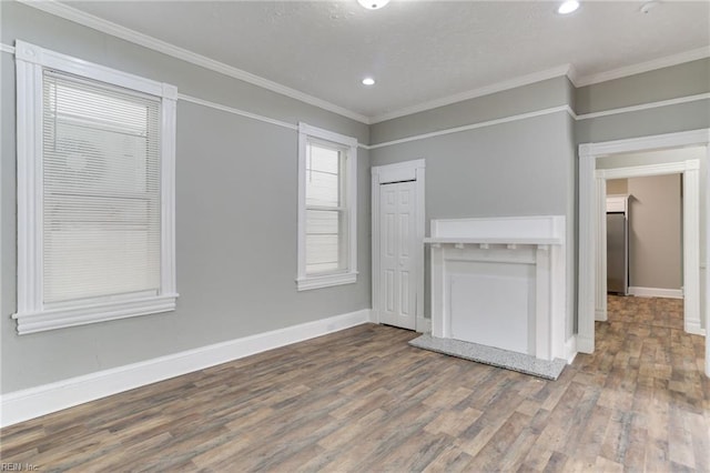 unfurnished room with wood-type flooring and ornamental molding