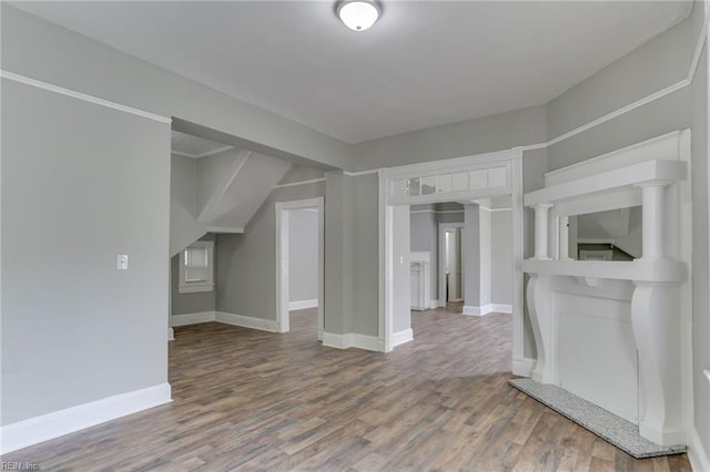 unfurnished living room with wood-type flooring