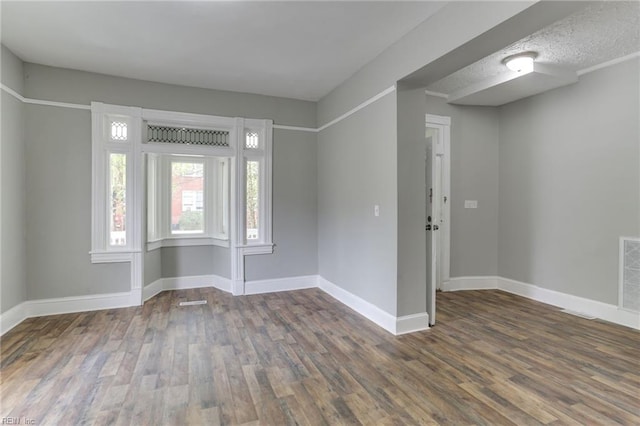 foyer entrance featuring dark hardwood / wood-style floors