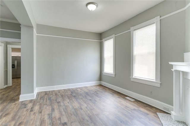 unfurnished living room with hardwood / wood-style floors