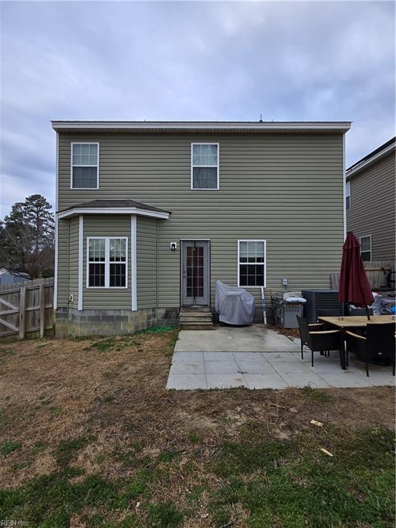 rear view of house featuring a patio