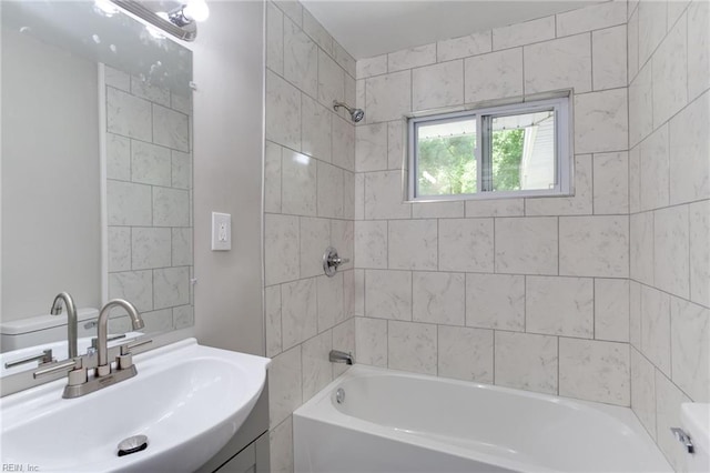 full bathroom with vanity, toilet, and tiled shower / bath