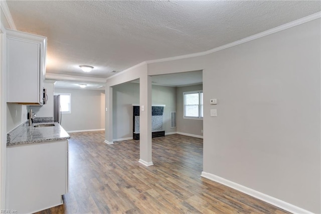 interior space with hardwood / wood-style floors, a wealth of natural light, and sink