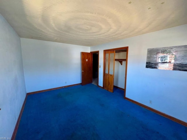 unfurnished bedroom with carpet and a closet