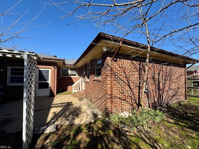 view of home's exterior with a patio area