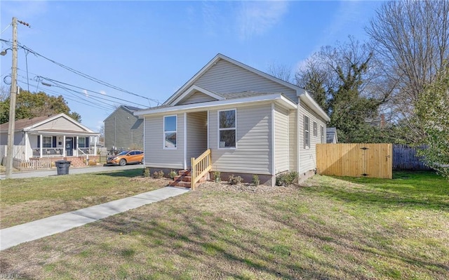 bungalow-style house with a front lawn