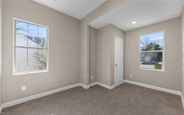 spare room featuring carpet floors