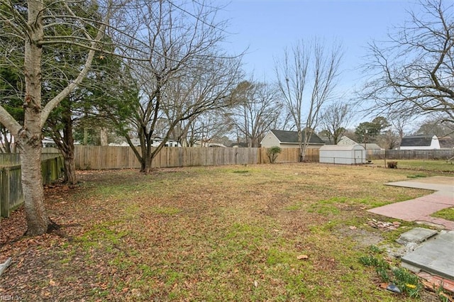 view of yard with an outbuilding and a patio