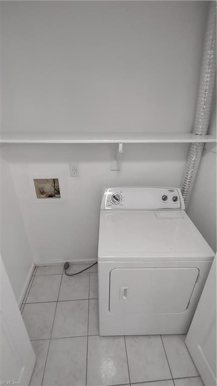 washroom with washer / clothes dryer and light tile patterned flooring