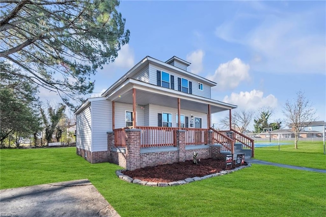 view of front of property with a front lawn and covered porch