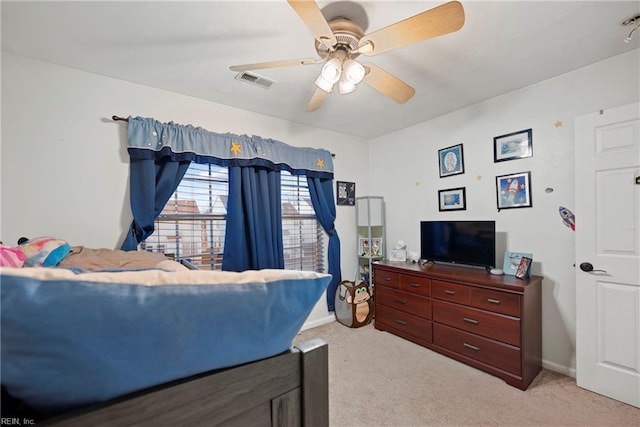 bedroom featuring light colored carpet and ceiling fan