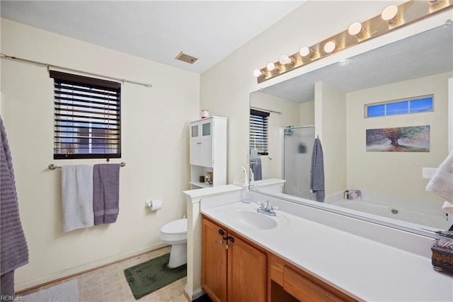 full bathroom with vanity, toilet, and separate shower and tub