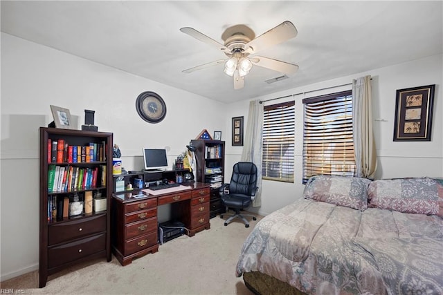 bedroom with light colored carpet and ceiling fan