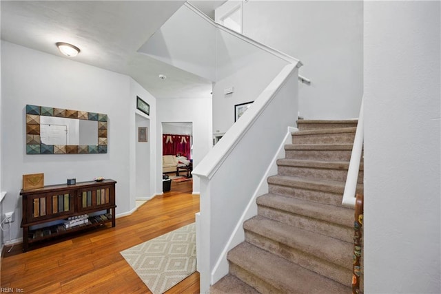 stairway with wood-type flooring