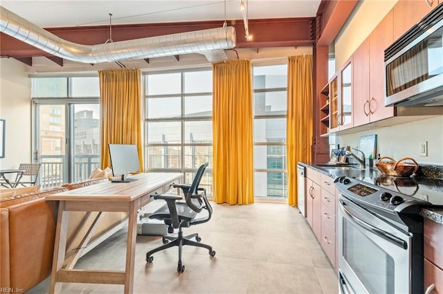 interior space with appliances with stainless steel finishes and sink