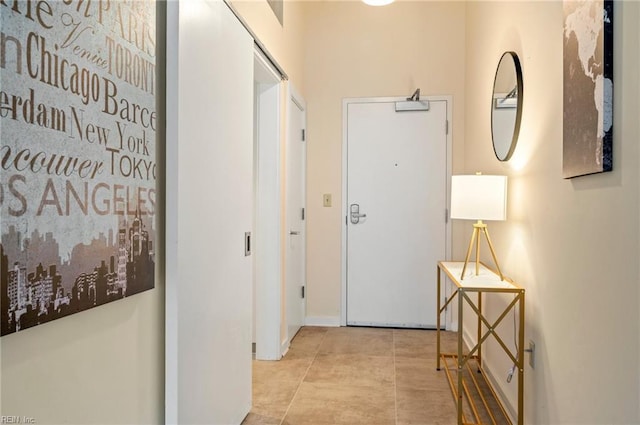 hall with light tile patterned floors