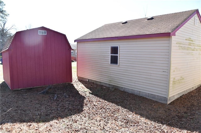 view of home's exterior with a shed