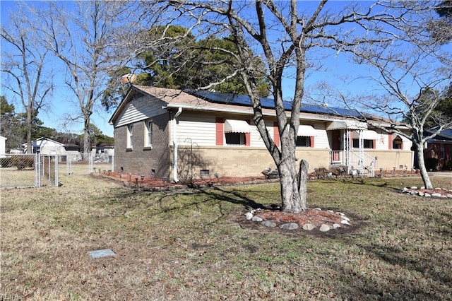 view of side of property with a yard