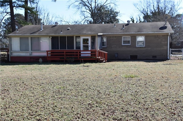 back of house with a lawn