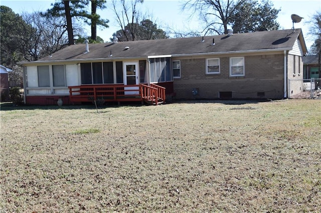 rear view of property with a lawn