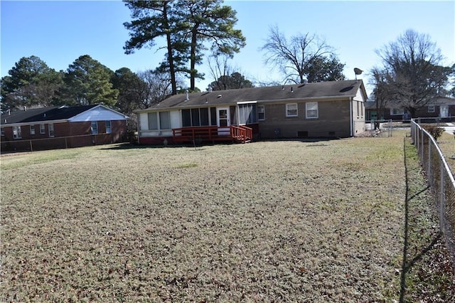 back of house featuring a yard