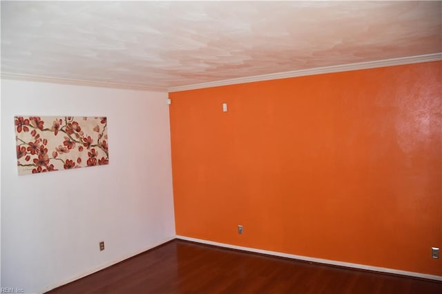 unfurnished room with crown molding and hardwood / wood-style floors