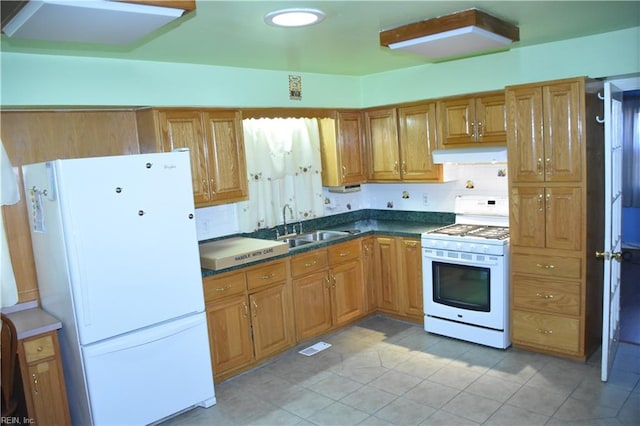 kitchen with white appliances and sink