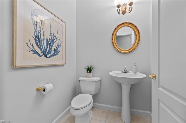 bathroom with tile patterned floors and toilet