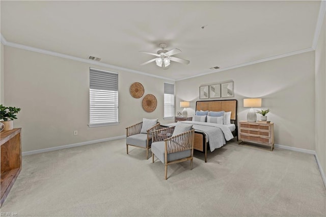 bedroom featuring crown molding, light carpet, and ceiling fan