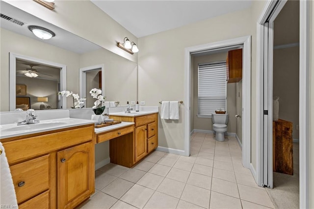 bathroom with tile patterned floors, toilet, and vanity