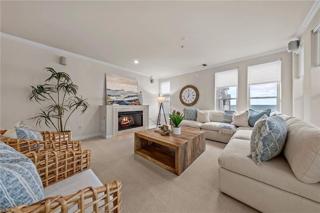 carpeted living room featuring a tiled fireplace and ornamental molding