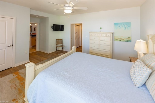 bedroom with ceiling fan and light hardwood / wood-style flooring