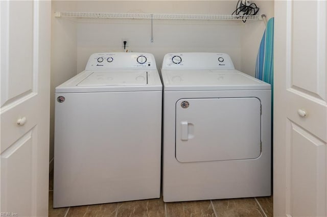 laundry room with washing machine and dryer