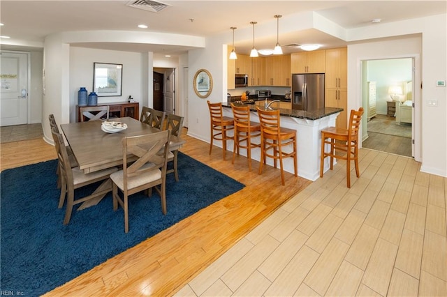 dining area featuring light hardwood / wood-style floors