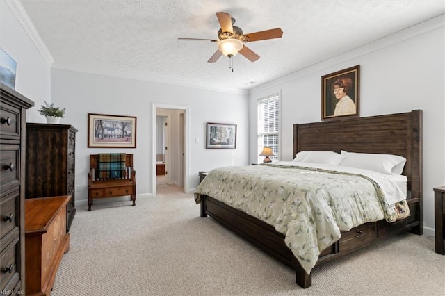 carpeted bedroom featuring ceiling fan, ornamental molding, and a textured ceiling