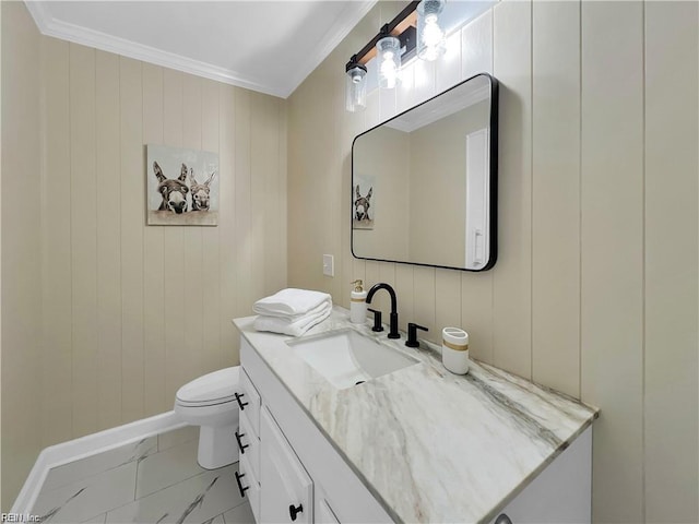 bathroom featuring ornamental molding, toilet, and vanity