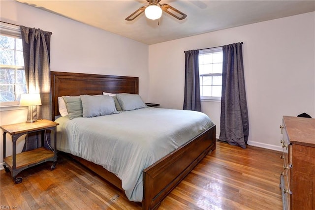 bedroom with hardwood / wood-style flooring and ceiling fan